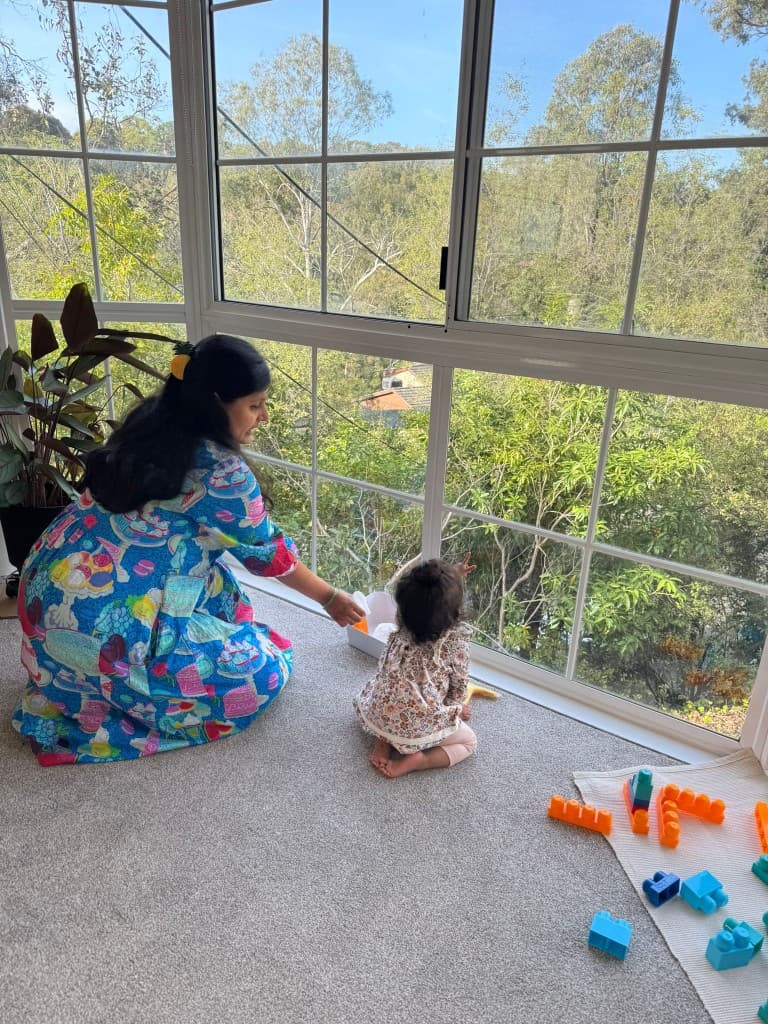 Parent and toddler exploring Montessori activities together